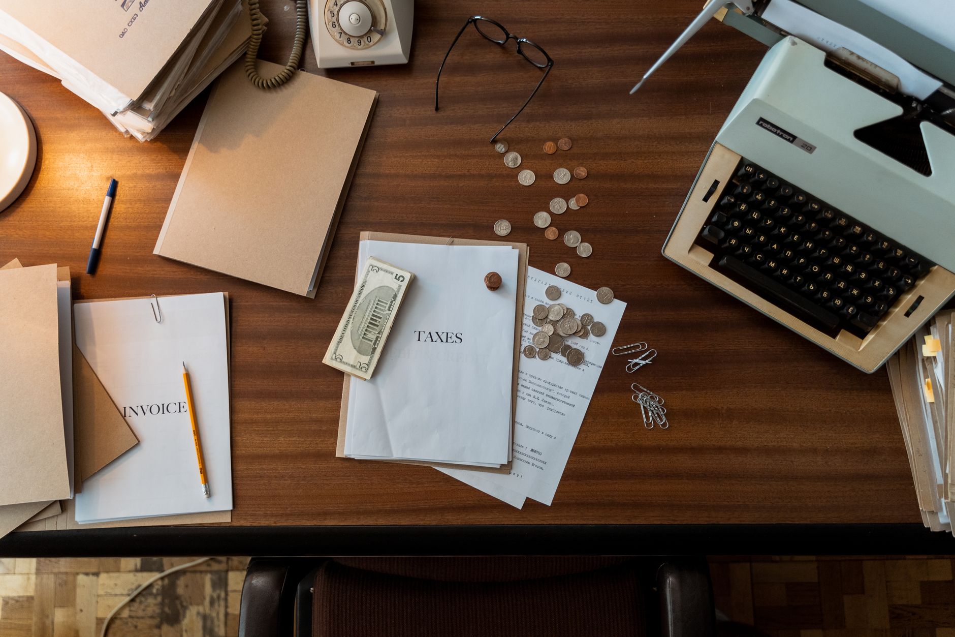 Desktop with financial documents and screens